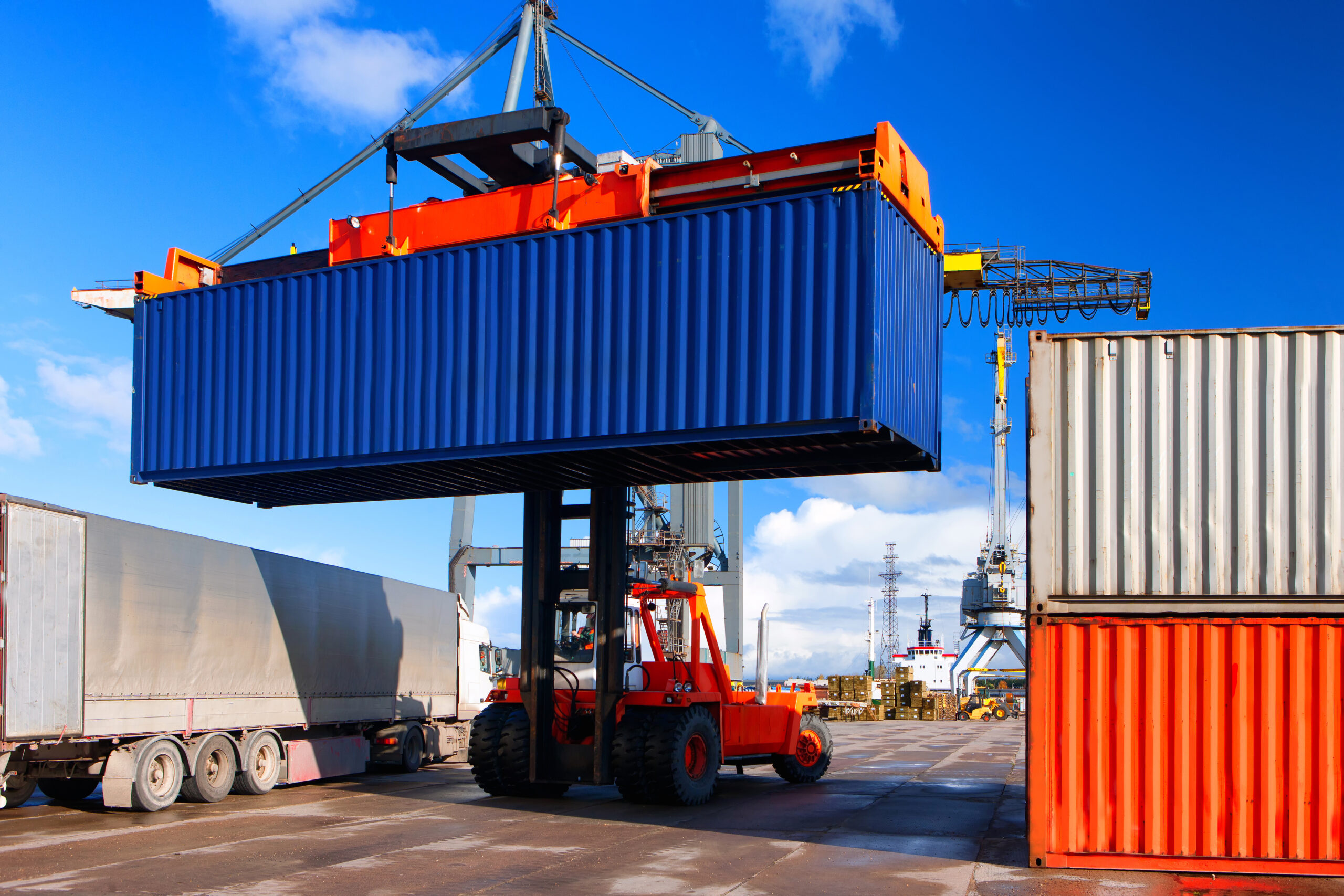 Loading and unloading of containers crane truck and special truck in the port on a sunny day